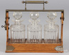 A Betjemann and Sons oak Tantalus