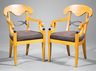 A pair of Biedermeier-style figured elm and parcel ebonized armchairs, 20th century
