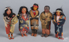 A grouping of six Skookum Native American Indian dolls