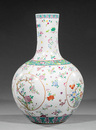 Large Chinese Famille Rose Porcelain Bottle Vase, decorated with bird and flower roundels on a white ground strewn with flower sprays