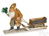 A German composition Santa Claus pulling a log sleigh Christmas figure