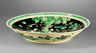 Chinese Famille Noire Porcelain Charger, 19th/20th c., painted with pairs of phoenix birds on rockwork beneath tree with further pairs of birds