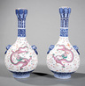 Pair of Chinese Famille Rose Decorated Blue and White Porcelain Bottle Vases, lotus pod mouths, Buddhist lion mask-ring handles, decorated with iron red and pink dragons pursuing the flaming pearl