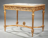 An antique Louis XVI-style carved salon table, late 19th century
