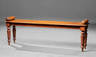 A Regency carved mahogany hall bench, circa 1825, attributed to Gillows of Lancaster