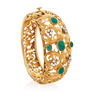 EMERALD, DIAMOND & YELLOW GOLD CUFF BRACELET, concentric design of scrolling acanthus leaves accented by oval emerald cabochons and RBC diamonds clusters
