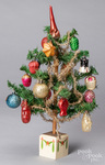 Small German feather tree, with blown glass ornaments on a stenciled tree stand