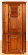 A diminutive pine one-piece corner cupboard, circa 1800