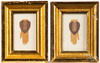 A pair of cut paper heart-in-hand love tokens